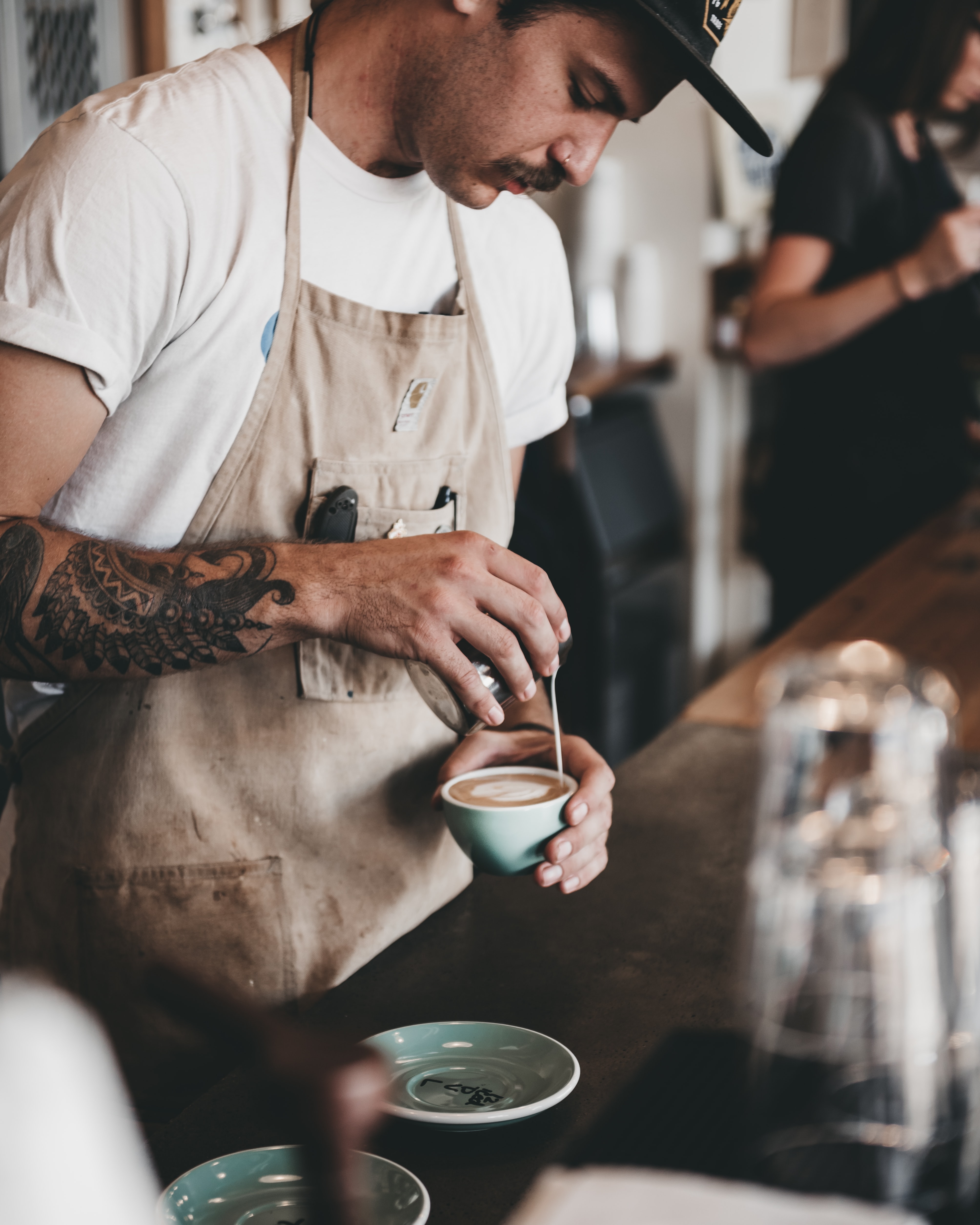 Barista pouring coffee